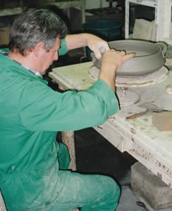 Italian Potter applying handles with a "slip"